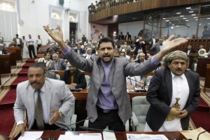 Member of Yemen's Parliament Bishr debates a law granting immunity to outgoing President Ali Abdullah Saleh over the killing of protesters, in Sanaa
