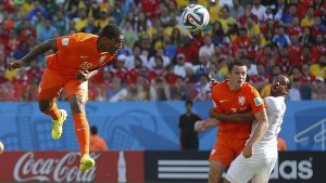 Fer of the Netherlands scores a goal with a header during their 2014 World Cup Group B soccer match against Chile at the Corinthians arena in Sao Paulo